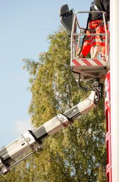 Workers in aerial work platform Stock Photos