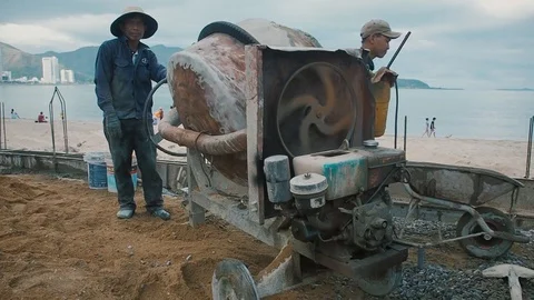 Workers and concrete mixer Stock Footage 90638113