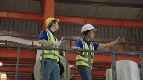 Workers and engineers inspect the factory maintenance plans. Stock Footage 172514970