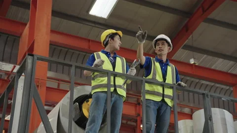 Workers and engineers inspect the factory maintenance plans. Stock Footage 172515133