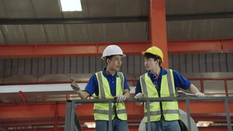 Workers and engineers inspect the factory maintenance plans. Stock Footage 173380089