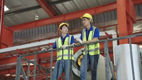 Workers and engineers inspect the factory maintenance plans. Stock Footage 174133025