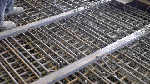 Workers and engineers pour foundation. Tons of concrete and reinforcement form a Stock Footage 98291391