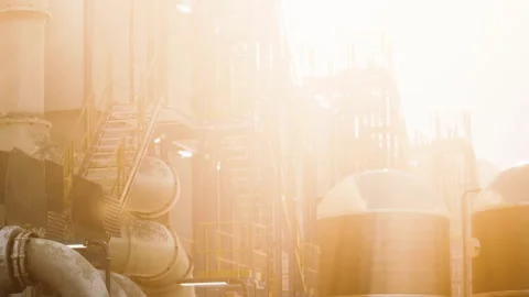 Workers and equipment in an industrial setting during bright daylight Stock Footage 340981090