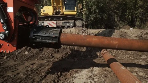 Workers and excavator on a construction site pile driving into the ground Stock Footage 71218947