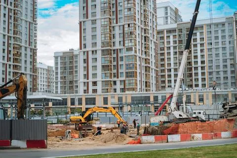 Workers and technic work at modern construction site of appartment recident.. 写真素材