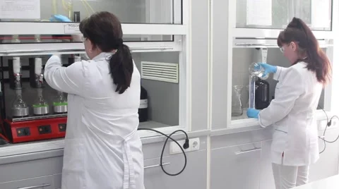 Workers and technicians operate production machinery Stock Footage 68077161