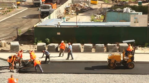Workers apply hot asphalt Stock Footage 67250836