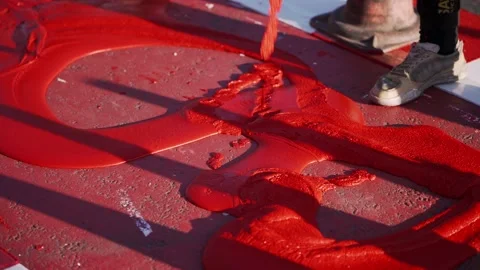 Workers apply red thermoplastic material. Cycling. Workers paint the bike lane. Stock Footage 167159110