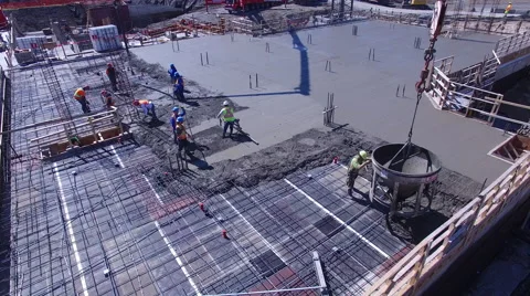 Workers applying concrete on building Stock Footage 64145371