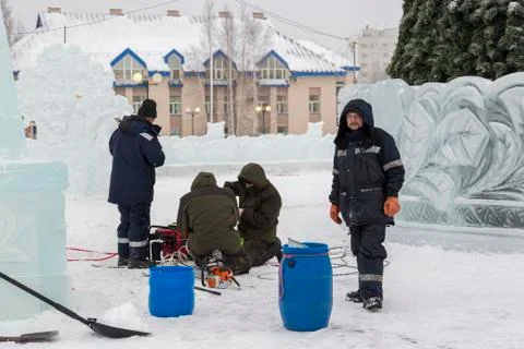 Workers are assembling a power cable for lighting 스톡 사진