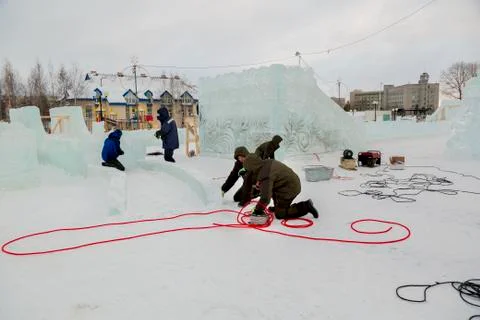 Workers are assembling a power cable for lighting 스톡 사진