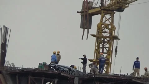 Workers are building a bridge across the river Stock Footage 328533174