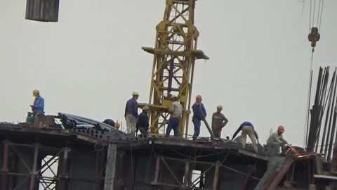 Workers are building a bridge across the river Stock Footage 328533228