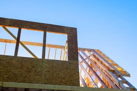 Workers are building the frame of house build wood beam roof structures 写真素材