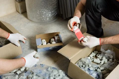 Workers are checking the complete set of pipe fittings. Stock Photos