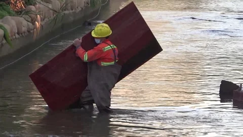 Workers are cleaning up river garbage Stock Footage 168348965