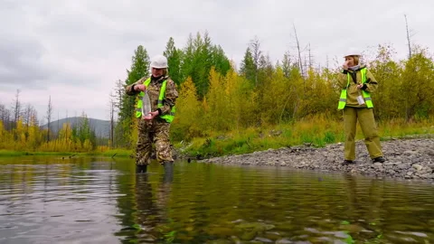 Workers are collecting river water samples to check the chemical composition Stock-Footage 170965636