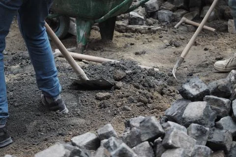 Workers are digging in a construction site in the daytime Stock Photos