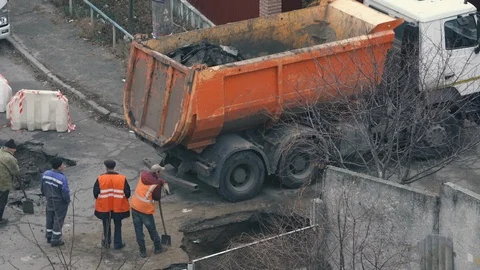 Workers are doing road repair on the outskirts of Kiev. Road construction Stock-Footage 120197728