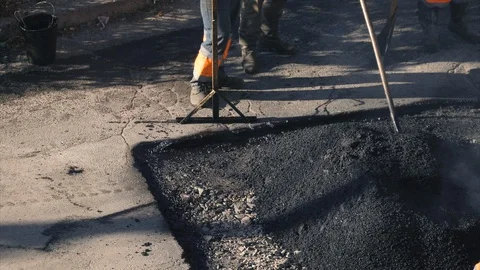 Workers are doing road repair on the outskirts of city Stock Footage 120401157