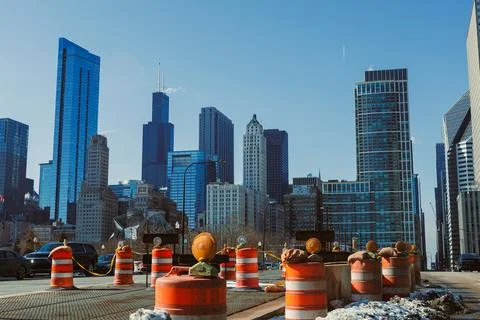 Workers are engaged in construction activities in downtown Chicago with traff Stock Photos