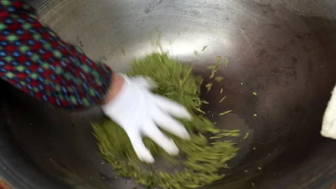 Workers are frying tea by hand Stock Footage 137315074