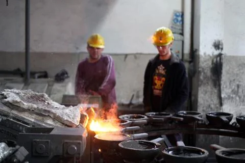 Workers are hard working in a foundry Stock Photos
