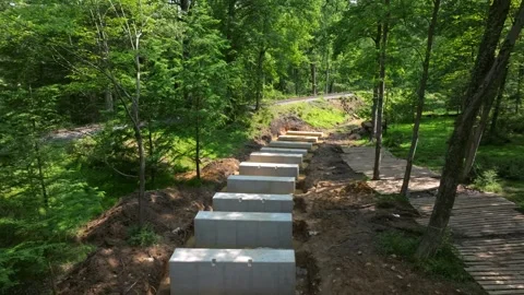 Workers are installing concrete blocks to create a New Rail Road Trestle 動画素材 316822625
