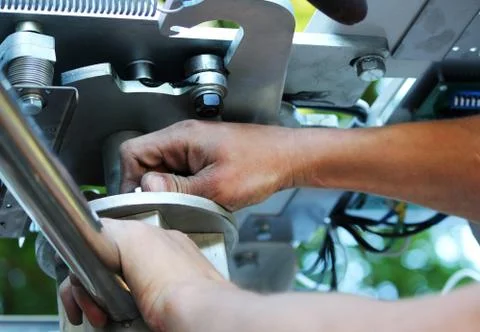 Workers are installing a full-height high turnstile at the entrance Stock Photos