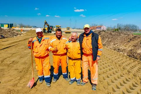 Workers are posing, having a break, free time, pause at work on construction Fotos de archivo