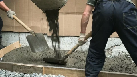 Workers are pouring concrete into the formwork. Stock Footage 159528548