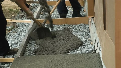Workers are pouring concrete into the formwork. Stock Footage 159952433