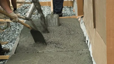 Workers are pouring concrete into the formwork. Stock Footage 164534824