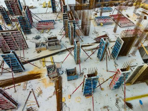 Workers are preparing for construction by arranging materials and forms on a  Fotos de archivo