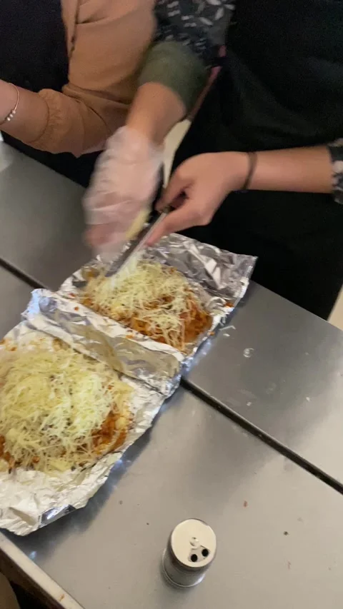 Workers are preparing food called "mie bakar" or roasted noodles Stock Footage 293039420