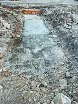 Workers are preparing a site for concrete pouring. The ground is cleared of d Stock Photos