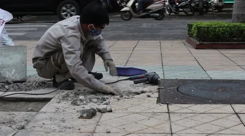 Workers are repairing pavement Stock Footage 58626599