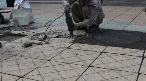 Workers are repairing pavement Stock Footage 58626662