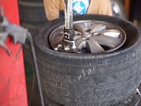 Workers are replacement the tire Stock Footage 105023614