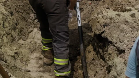 Workers are replacing an underground power transmission cable. The cable is Stock Footage 244635362