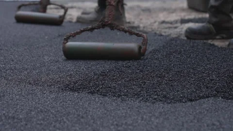 Workers are rolling out a special rubberized floor covering for a children's Stock Footage 293803997