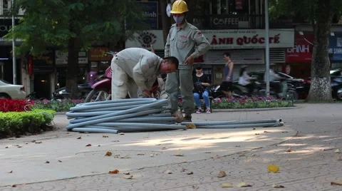 Workers are rolls of plastic pipes Stock Footage 58626090