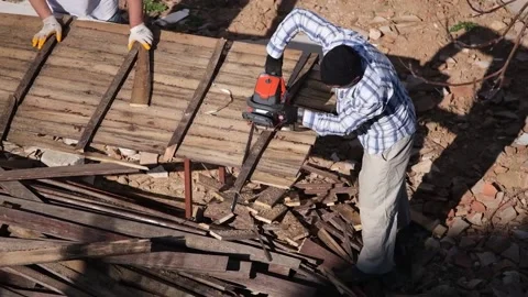 Workers are sawing boards with a chainsaw 2 Stock Footage 201600195