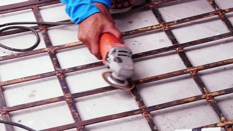 Workers are scrubbing removing rust and old paint from metal with Angle Grinder. Stock Footage 170016033