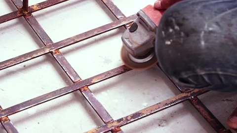 Workers are scrubbing removing rust and old paint from metal with Angle Grinder. Stock Footage 170016059