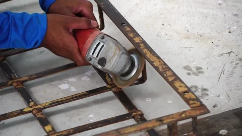 Workers are scrubbing removing rust and old paint from metal with Angle Grinder. Stock Footage 170016133