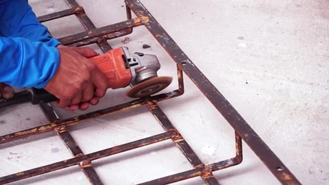 Workers are scrubbing removing rust and old paint from metal with Angle Grinder. Stock Footage 170016173