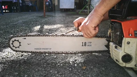 Workers are sharpening chainsaws manually. Stock Footage 148597122