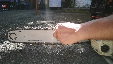 Workers are sharpening chainsaws manually. Stock Footage 148697579